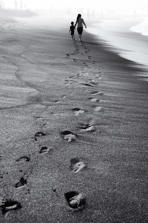 black and white sand footprints