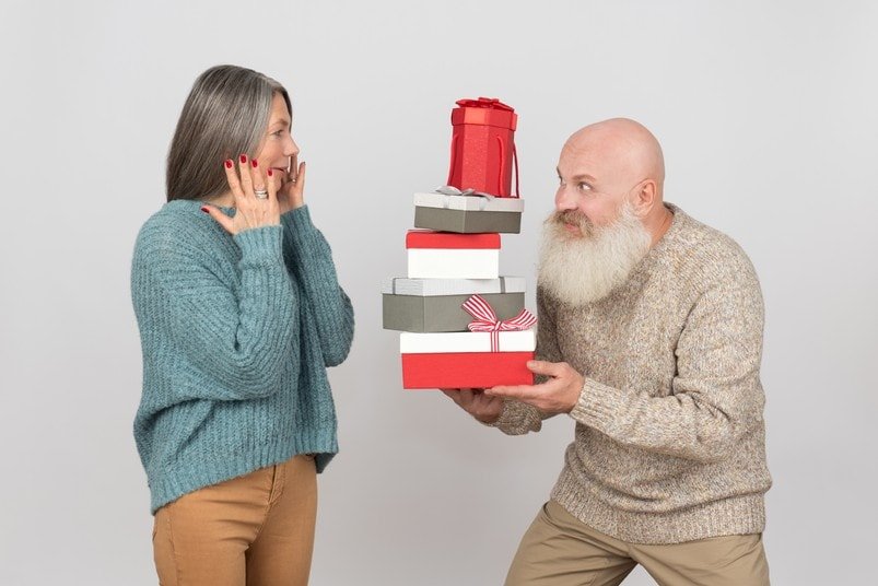 Old man gives presents to his wife