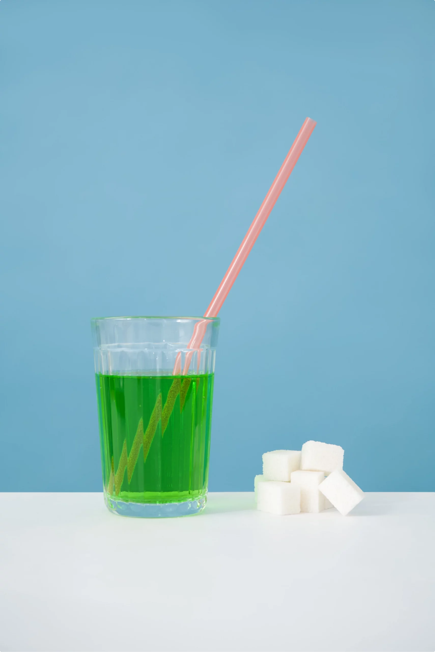 Green drink with straw and sugar wallpaper