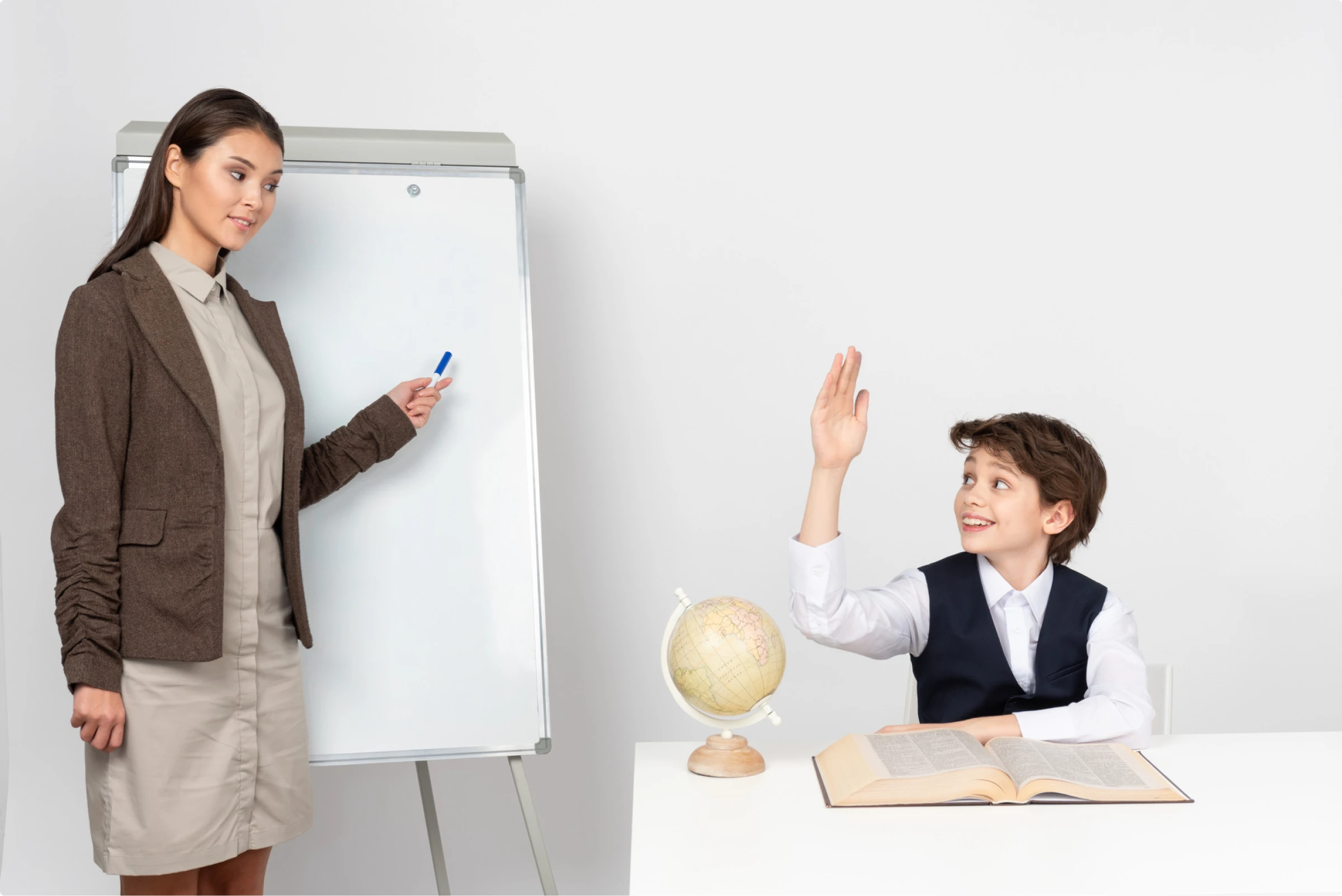 a photo of a teacher asking a question and a student is ready to answer it